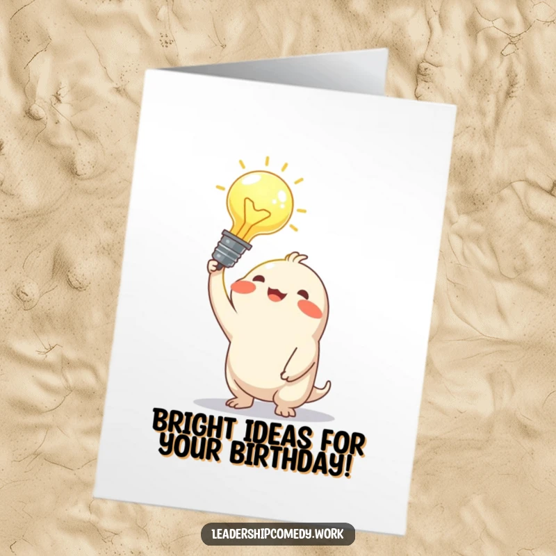 Funny Free Printable Birthday Card: Creature with joyful expression holding a glowing idea bulb, wishing happy birthday.