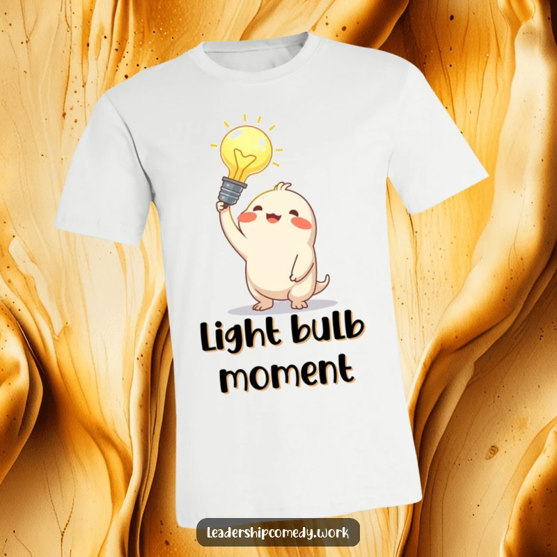 Funny t-shirt depicting a joyful creature holding a large, illuminated idea bulb overhead, representing a moment of clarity and creativity.